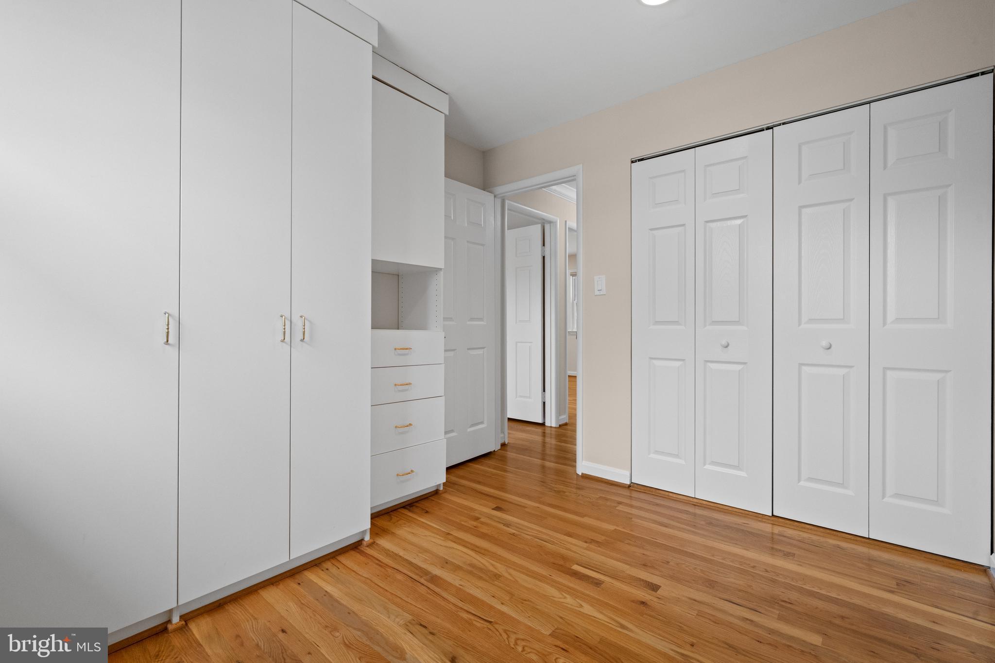 6119 Greeley Boulevard Springfield, VA 22152 - Photo 20 of 38 a view of an empty room with wooden floor