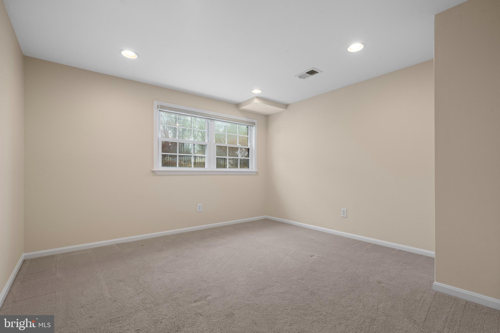 6119 Greeley Boulevard Springfield, VA 22152 - Photo 22 of 38 an empty room with windows