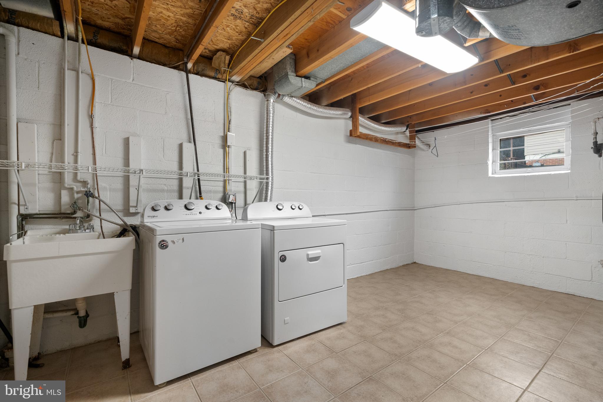 6119 Greeley Boulevard Springfield, VA 22152 - Photo 28 of 38 a utility room with dryer and washer
