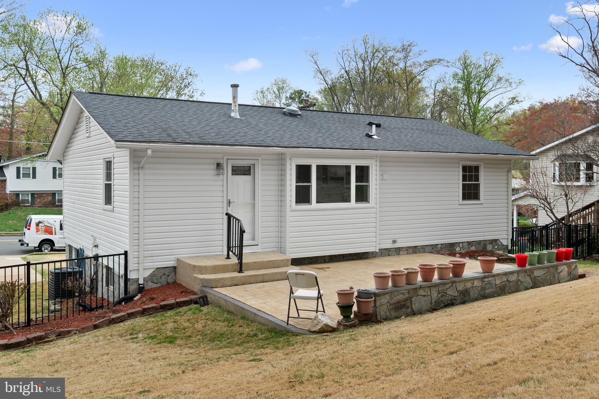 6119 Greeley Boulevard Springfield, VA 22152 - Photo 36 of 38 a view of a house with a patio