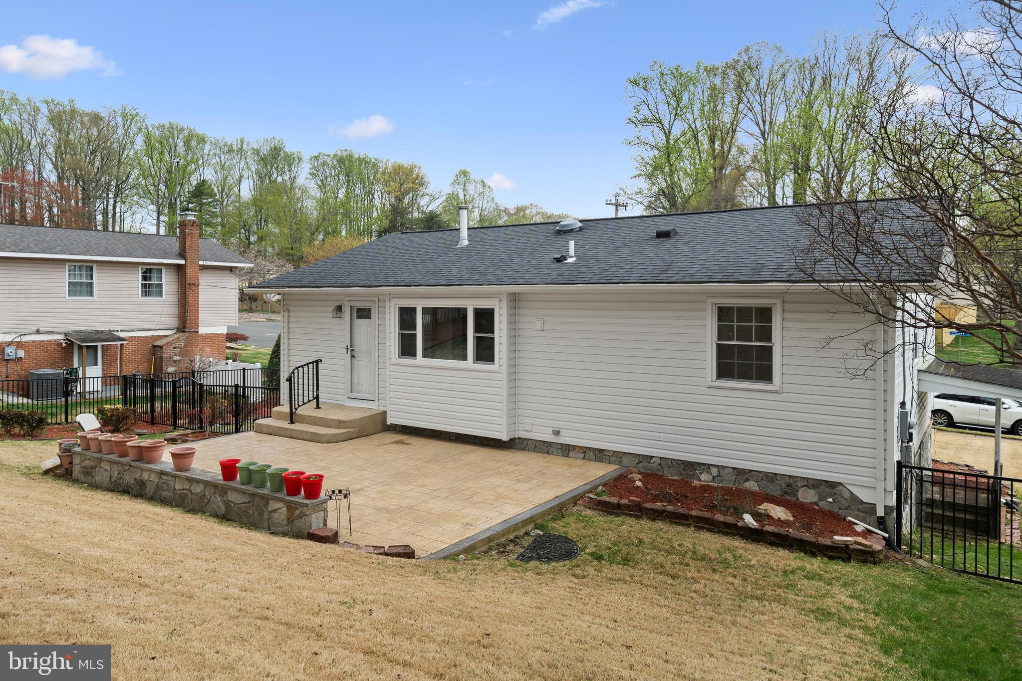 6119 Greeley Boulevard Springfield, VA 22152 - Photo 37 of 38 a view of a house with a backyard and sitting area