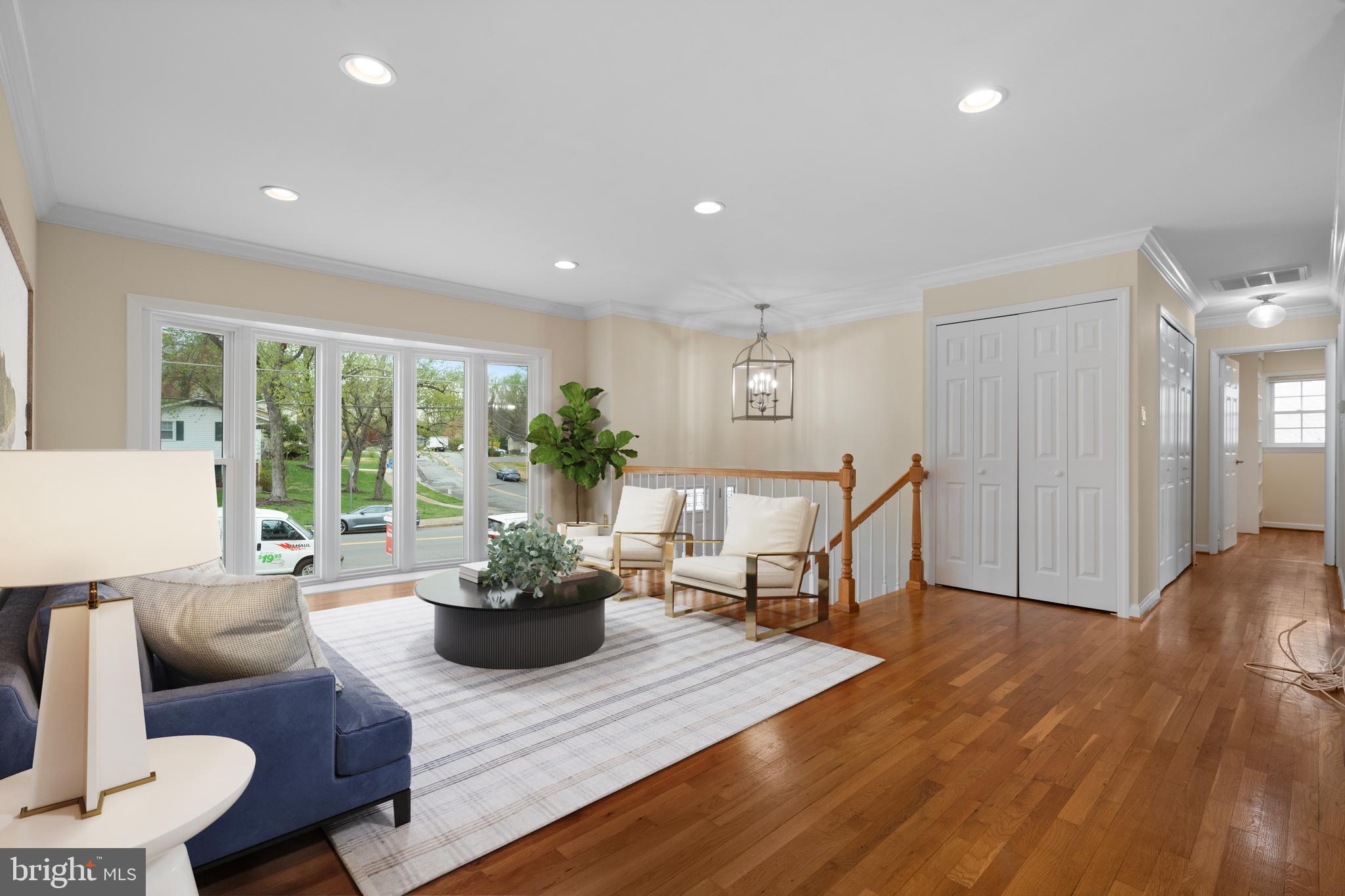 6119 Greeley Boulevard Springfield, VA 22152 - Photo 9 of 38 a living room with furniture and a potted plant