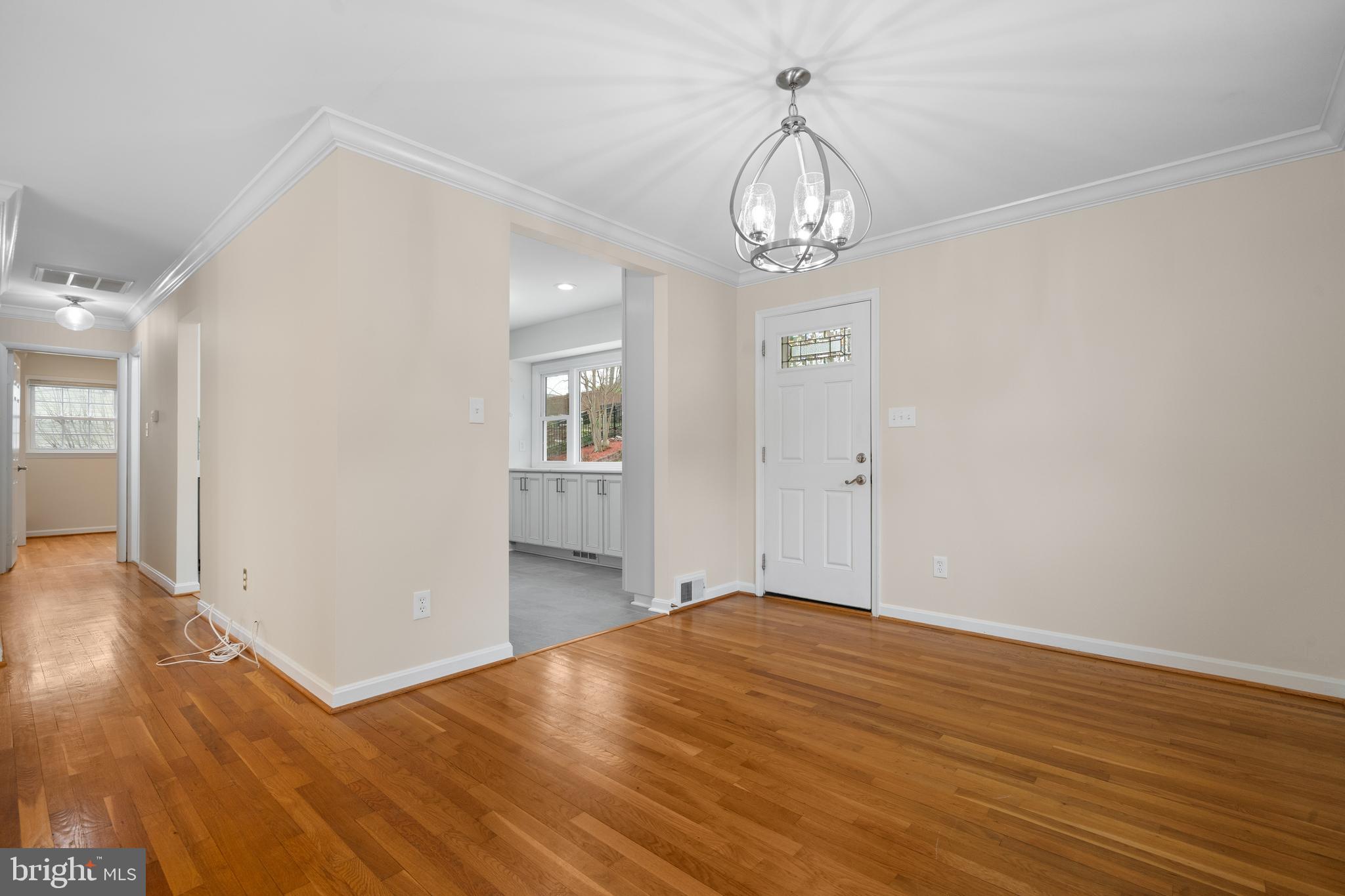6119 Greeley Boulevard Springfield, VA 22152 - Photo 10 of 38 wooden floor in an empty room with a window