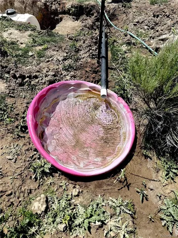 a living room with a couch and a stove top oven