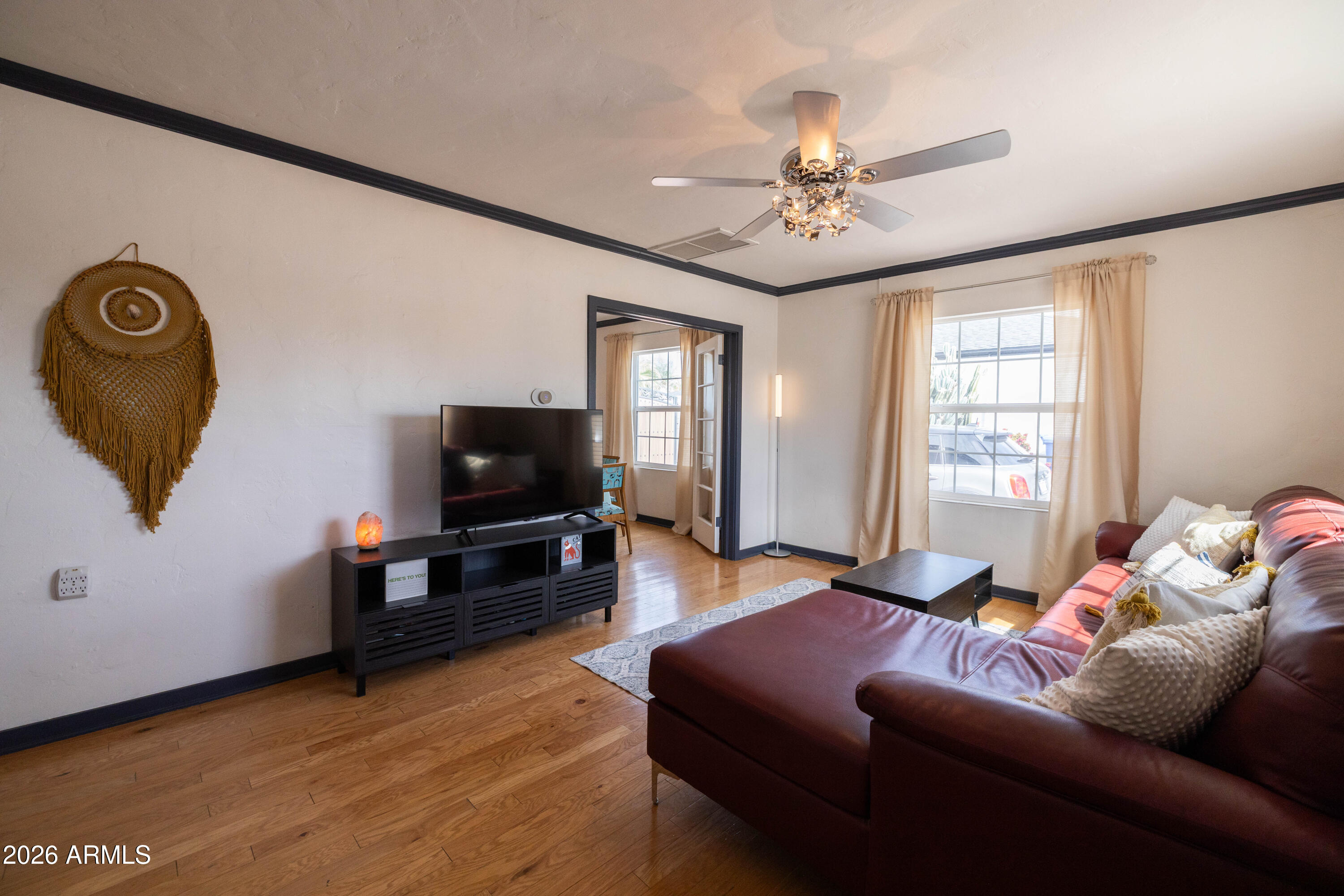 1222 East Almeria Road Phoenix, AZ 85006 - Photo 11 of 55 a living room with furniture and a flat screen tv