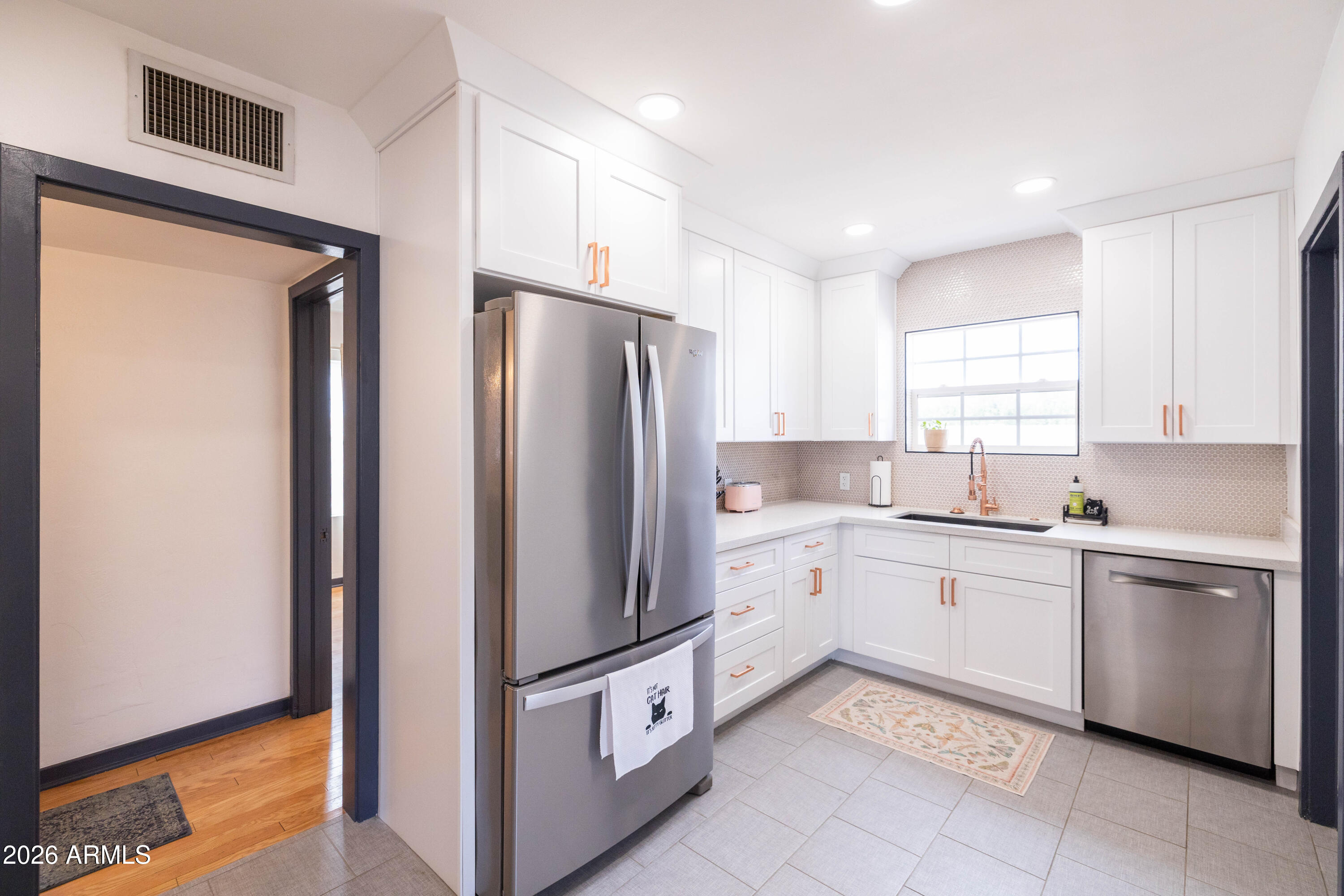 1222 East Almeria Road Phoenix, AZ 85006 - Photo 19 of 55 a kitchen with stainless steel appliances granite countertop a refrigerator and a sink