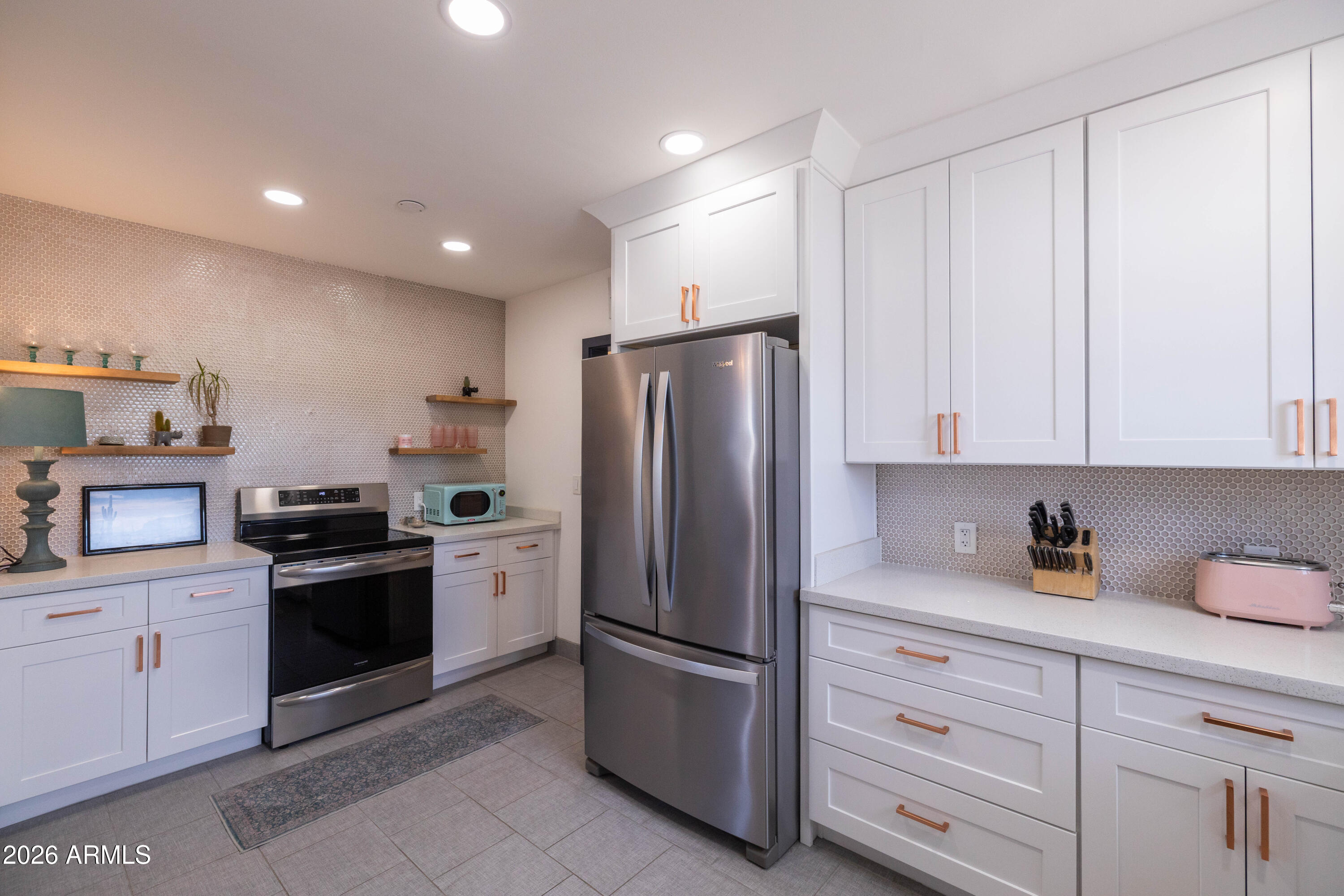 1222 East Almeria Road Phoenix, AZ 85006 - Photo 23 of 55 a kitchen with stainless steel appliances granite countertop a refrigerator sink and cabinets