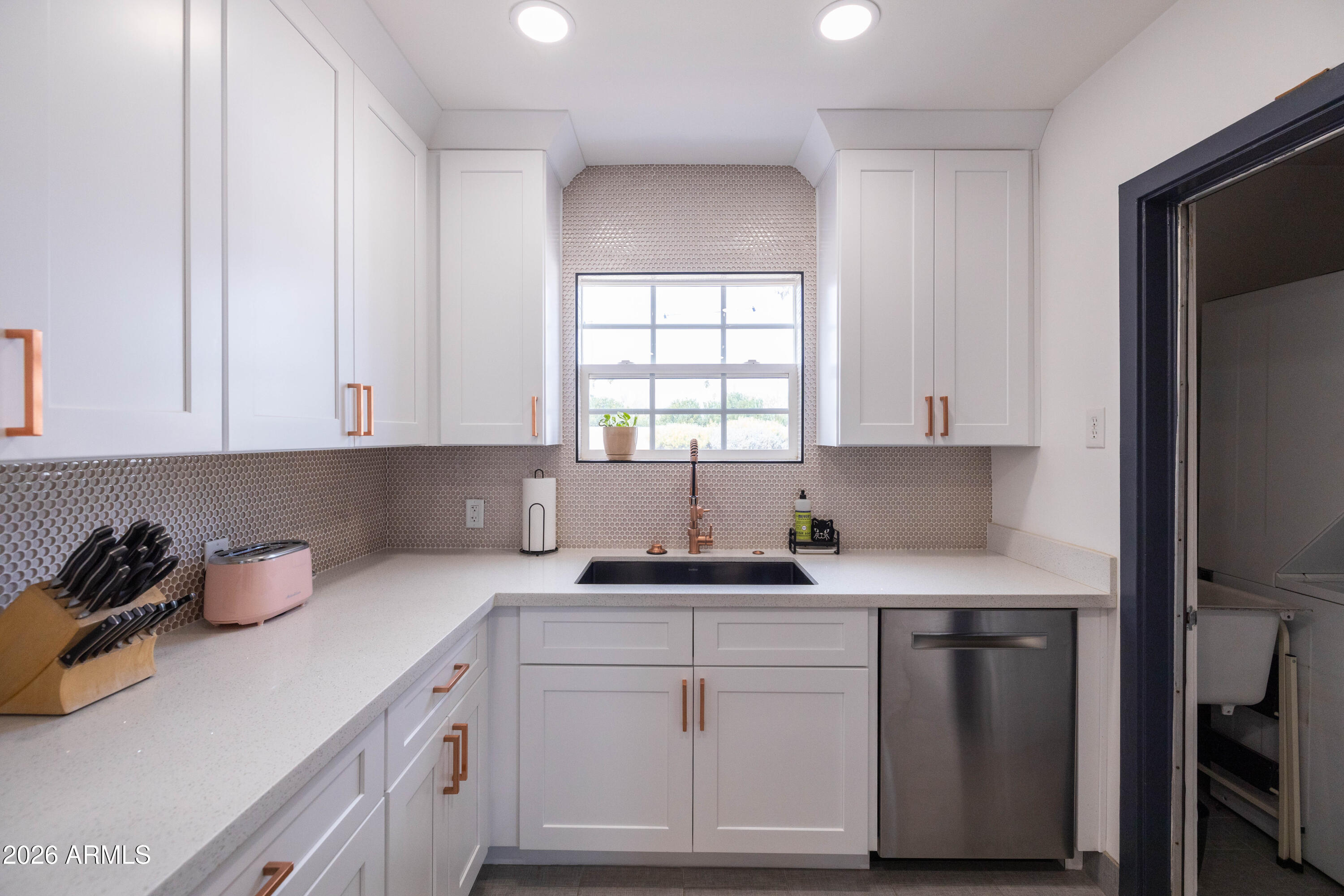 1222 East Almeria Road Phoenix, AZ 85006 - Photo 26 of 55 a kitchen with white cabinets and white appliances