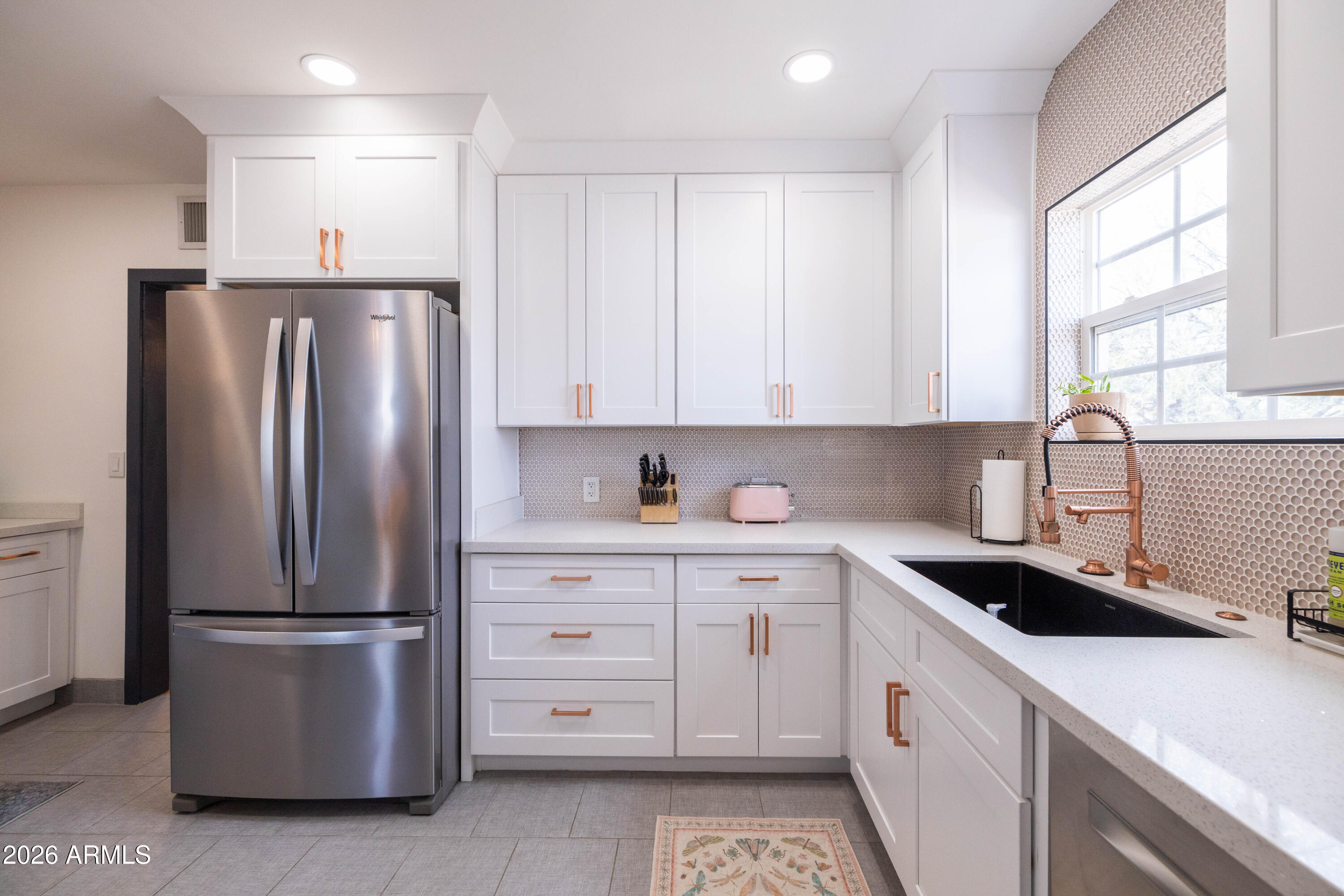 1222 East Almeria Road Phoenix, AZ 85006 - Photo 27 of 55 a kitchen with a refrigerator sink and cabinets