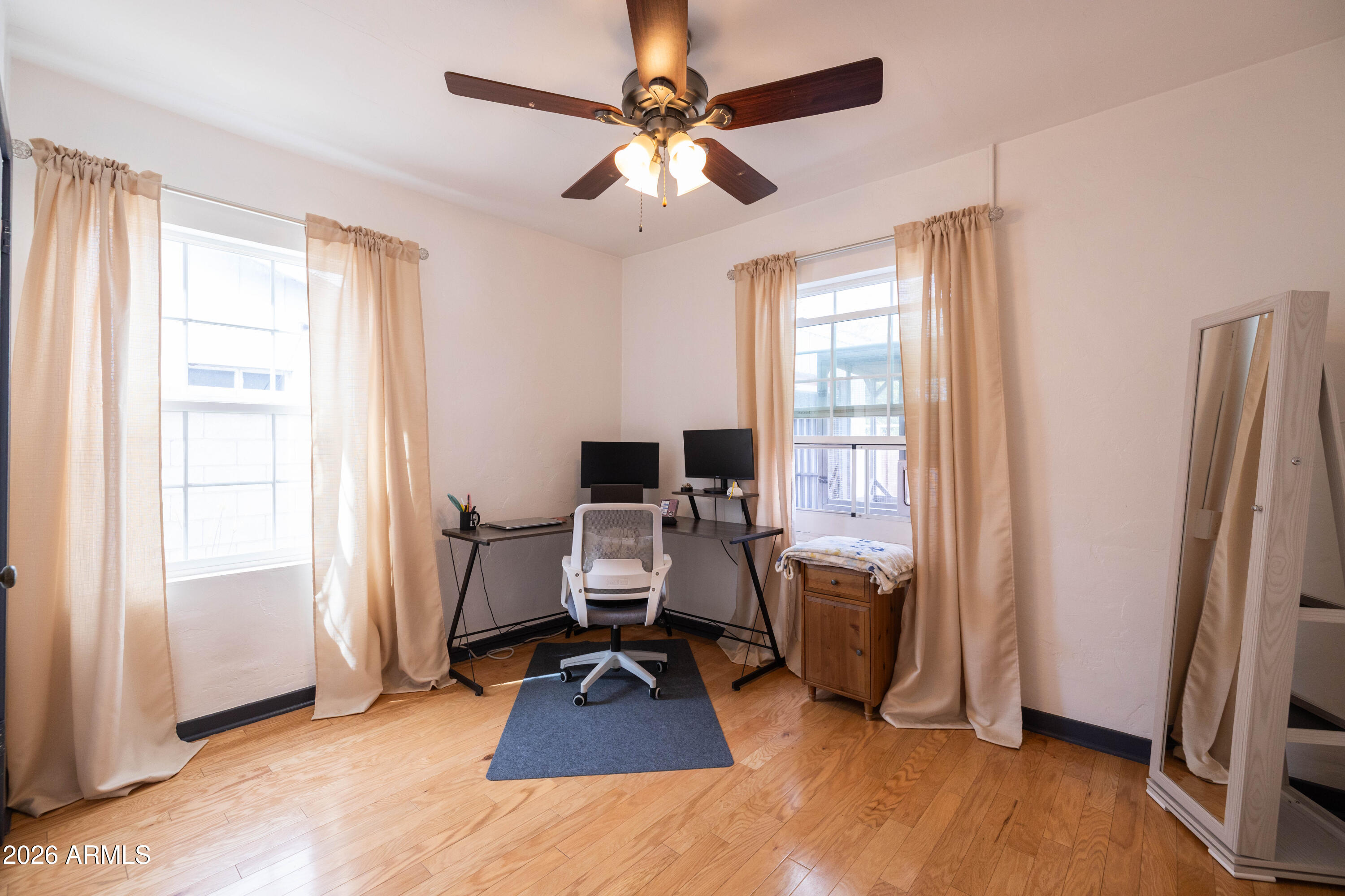 1222 East Almeria Road Phoenix, AZ 85006 - Photo 34 of 55 a view of a workspace with furniture and a window