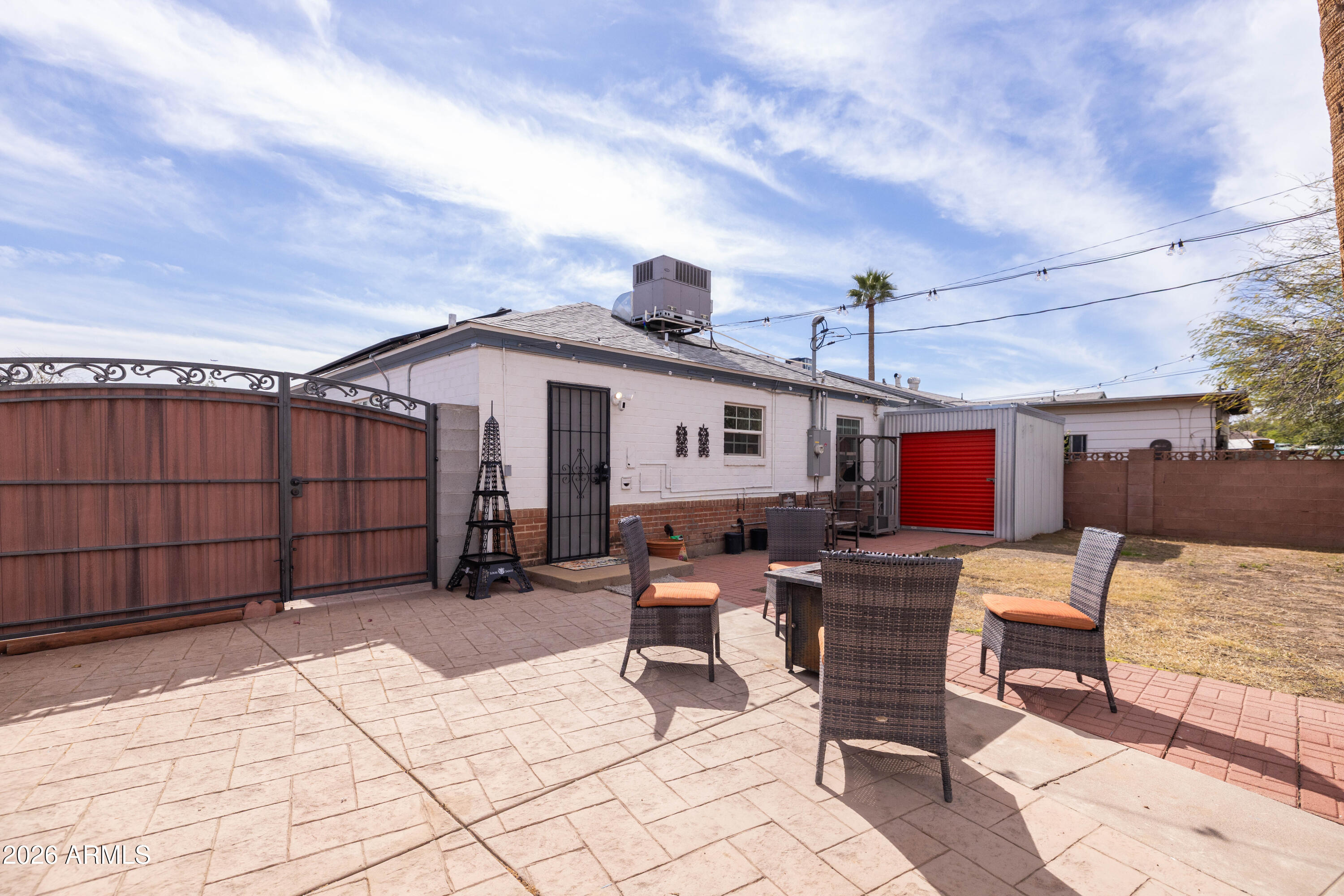 1222 East Almeria Road Phoenix, AZ 85006 - Photo 37 of 55 a roof deck with table and chairs and potted plants