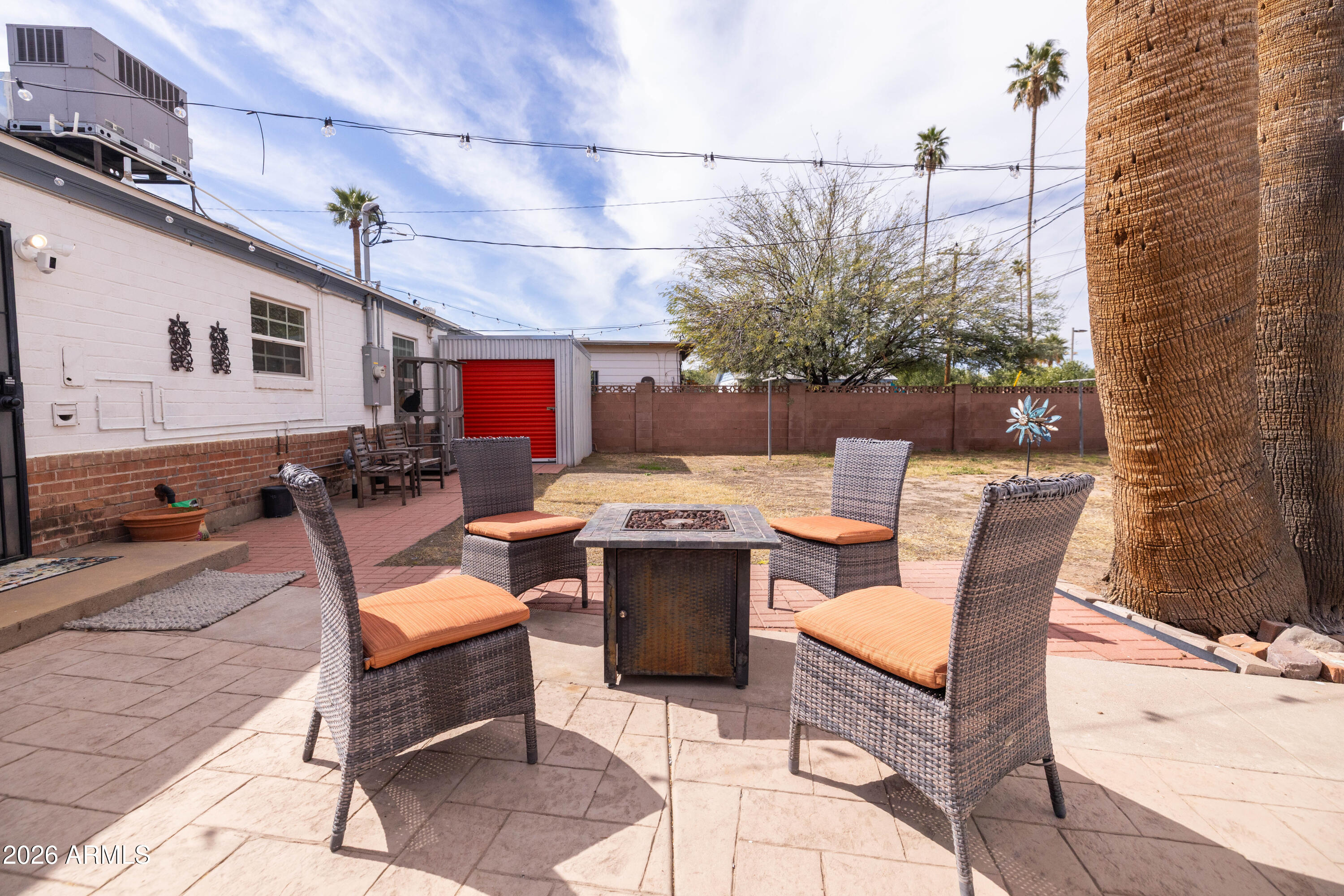 1222 East Almeria Road Phoenix, AZ 85006 - Photo 38 of 55 a view of a patio with a dining table and chairs with wooden floor
