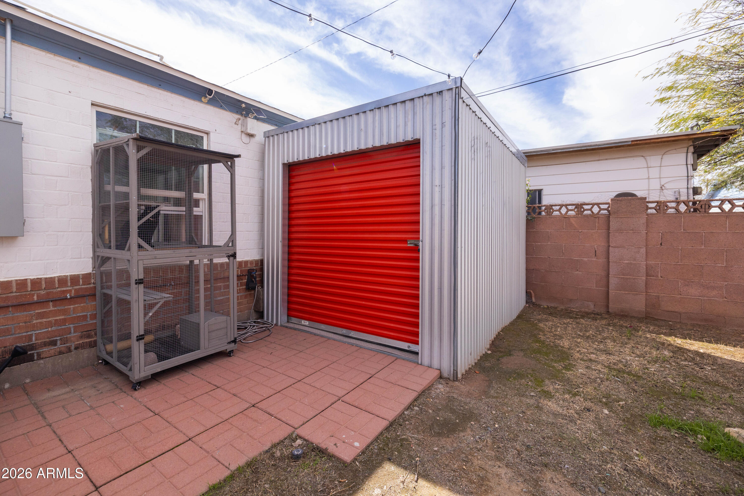 1222 East Almeria Road Phoenix, AZ 85006 - Photo 55 of 55 a view of a porch with a door and a refrigerator