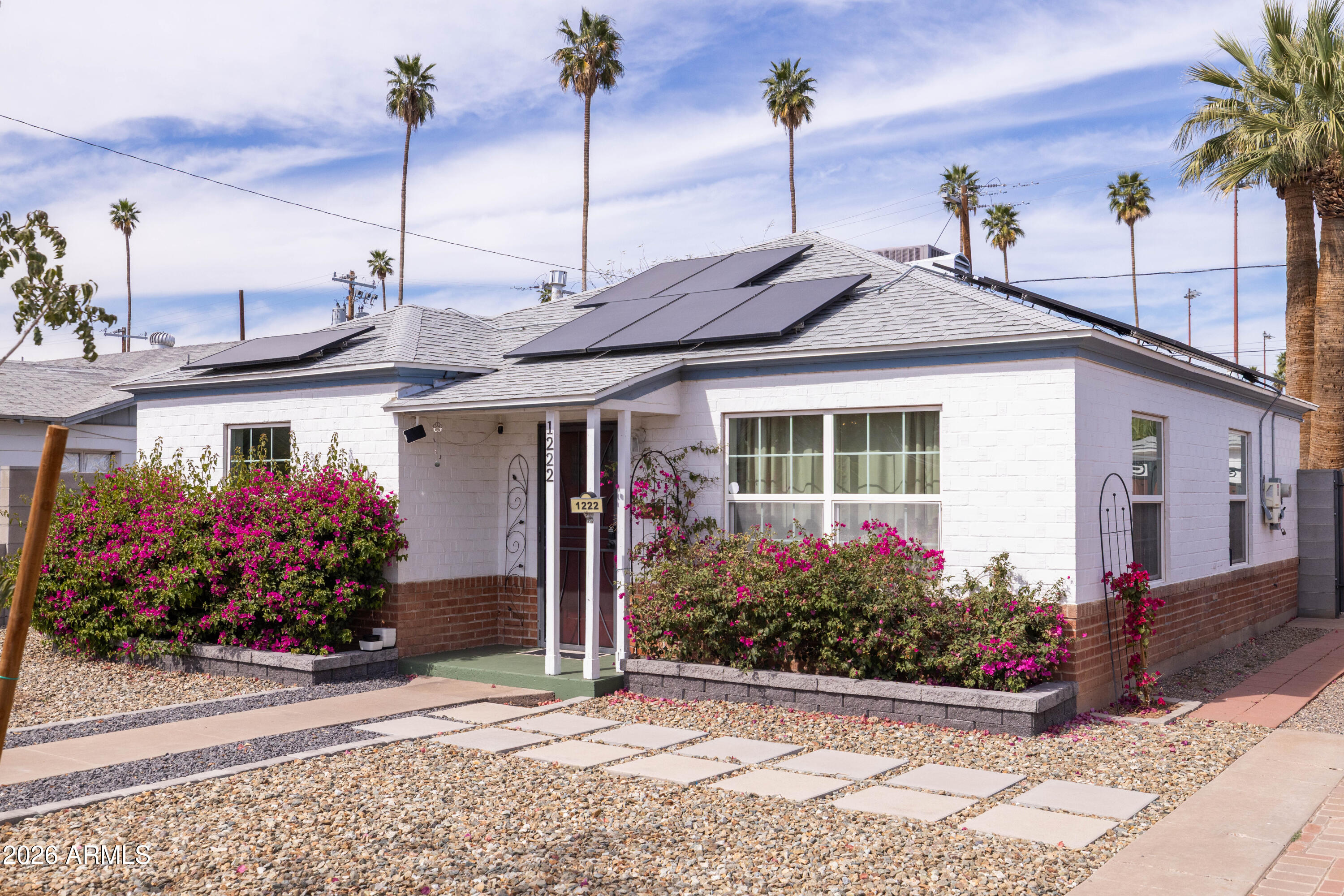 1222 East Almeria Road Phoenix, AZ 85006 - Photo 7 of 55 a front view of a house with a garden