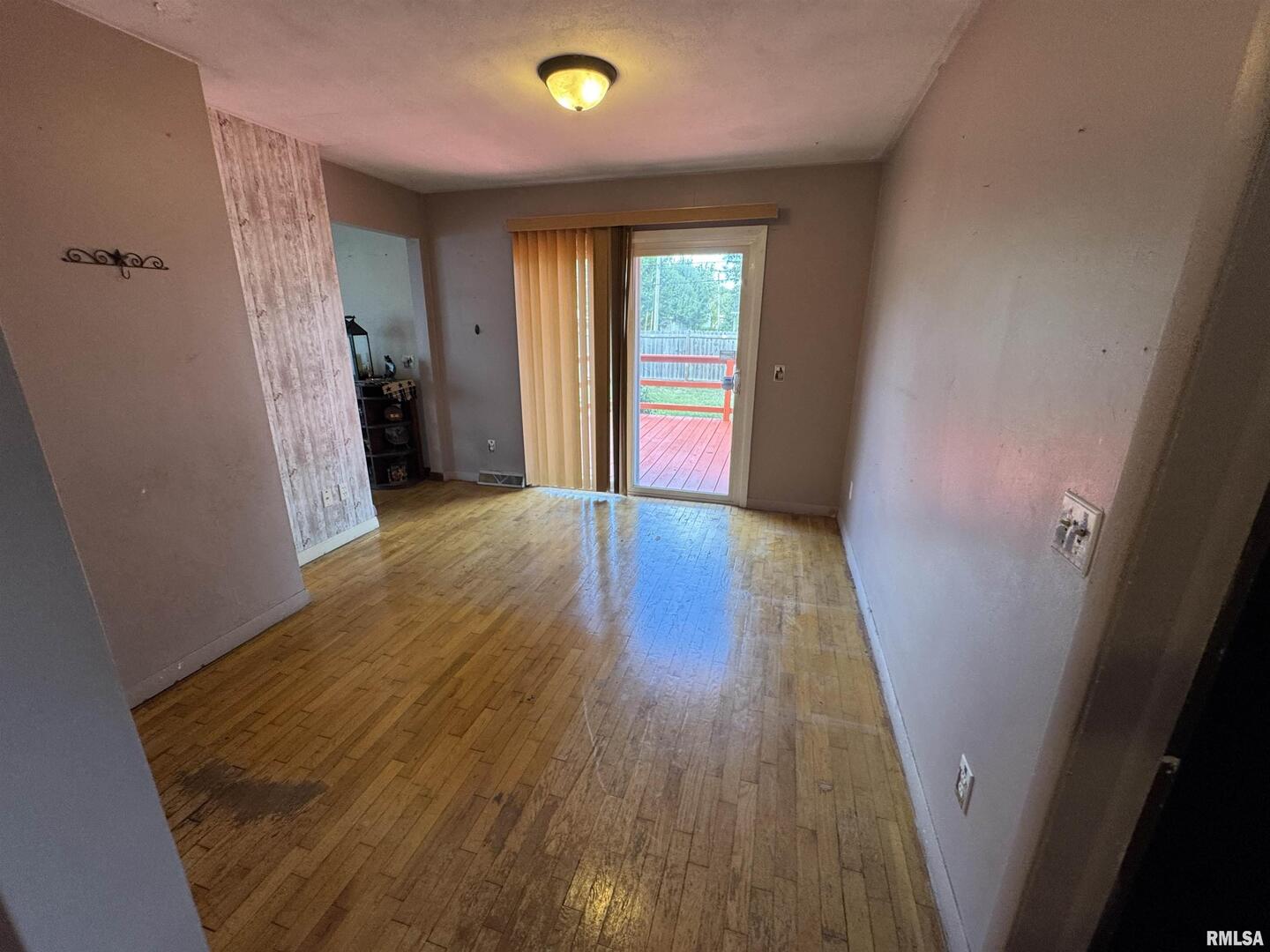 7 Holly Lane Flora, IL 62839 - Photo 13 of 42 wooden floor in an empty room with a window