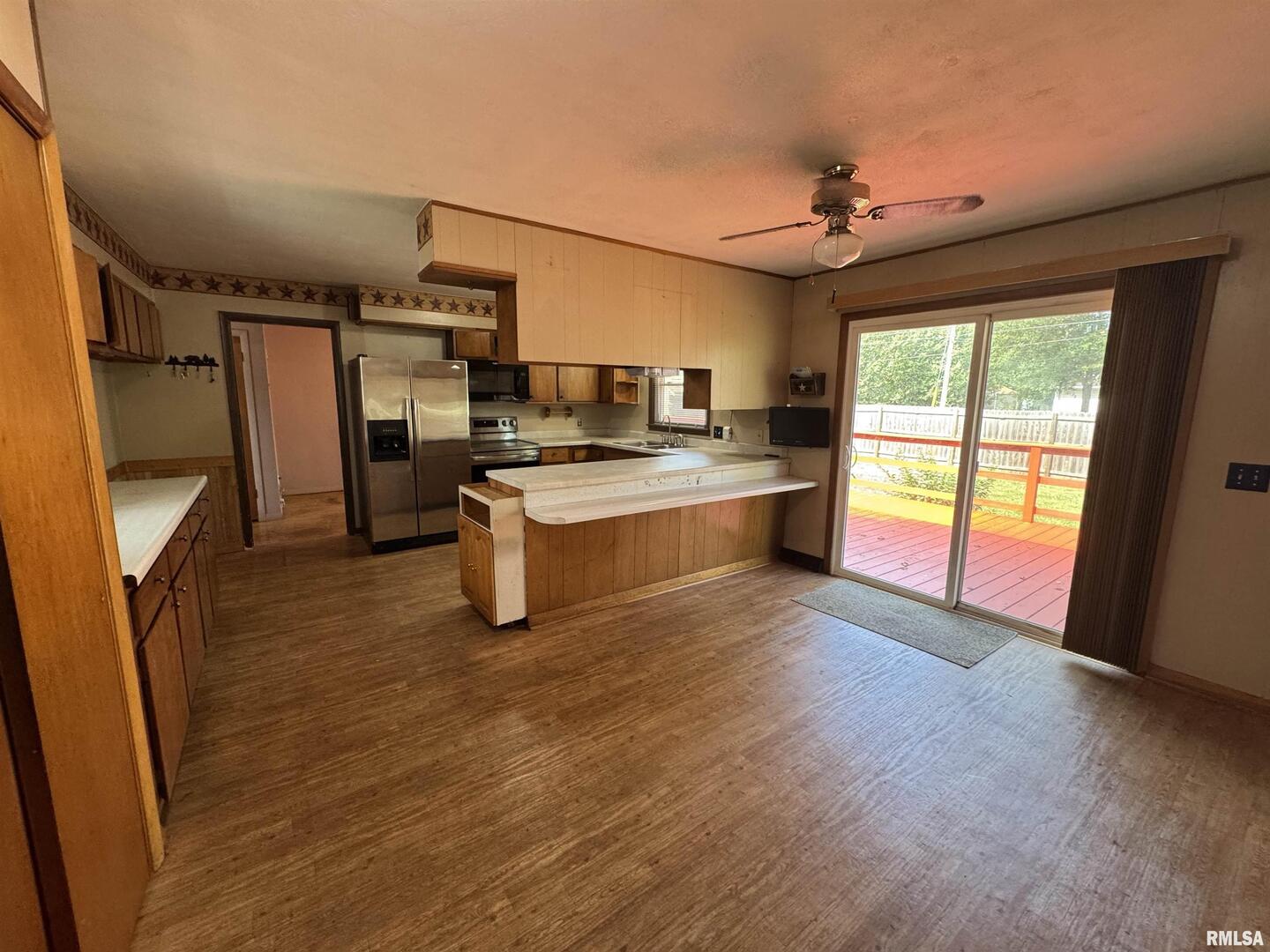 7 Holly Lane Flora, IL 62839 - Photo 14 of 42 a kitchen with stainless steel appliances a stove top oven a sink and a refrigerator