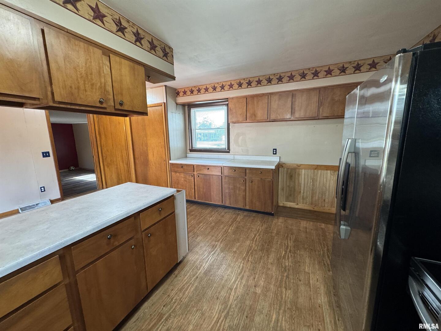 7 Holly Lane Flora, IL 62839 - Photo 17 of 42 a kitchen with cabinets and wooden floor