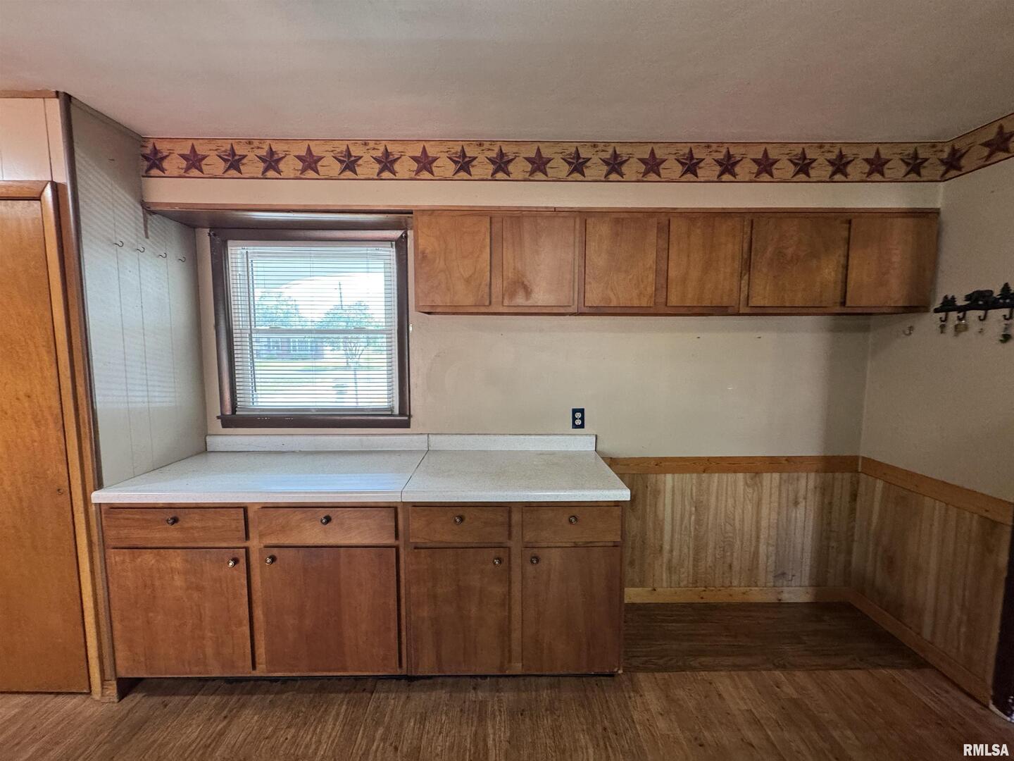 7 Holly Lane Flora, IL 62839 - Photo 18 of 42 a kitchen with a sink cabinets and a wooden floor