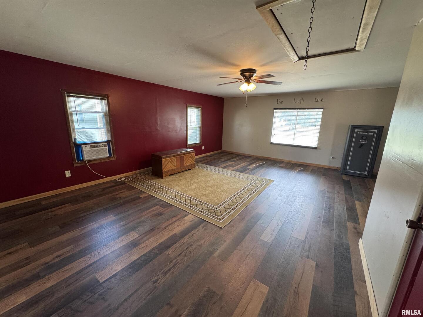 7 Holly Lane Flora, IL 62839 - Photo 23 of 42 a view of an empty room with window and wooden floor