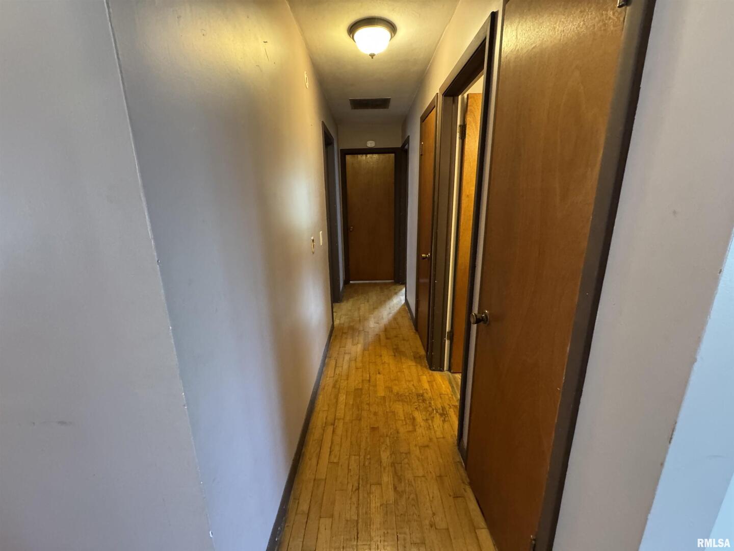 7 Holly Lane Flora, IL 62839 - Photo 24 of 42 a view of a hallway with wooden floor