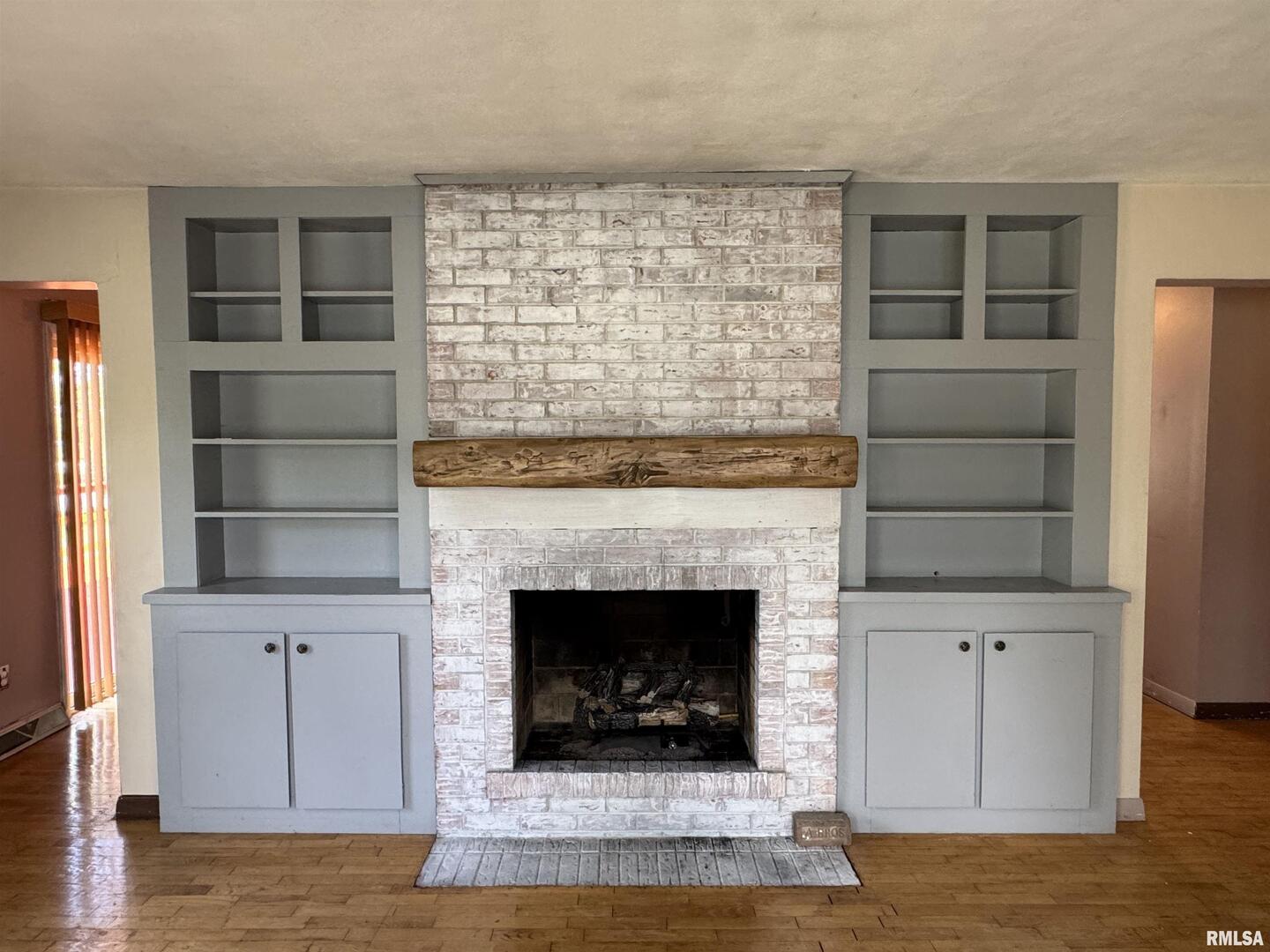 7 Holly Lane Flora, IL 62839 - Photo 6 of 42 a living room with a fireplace and a rug