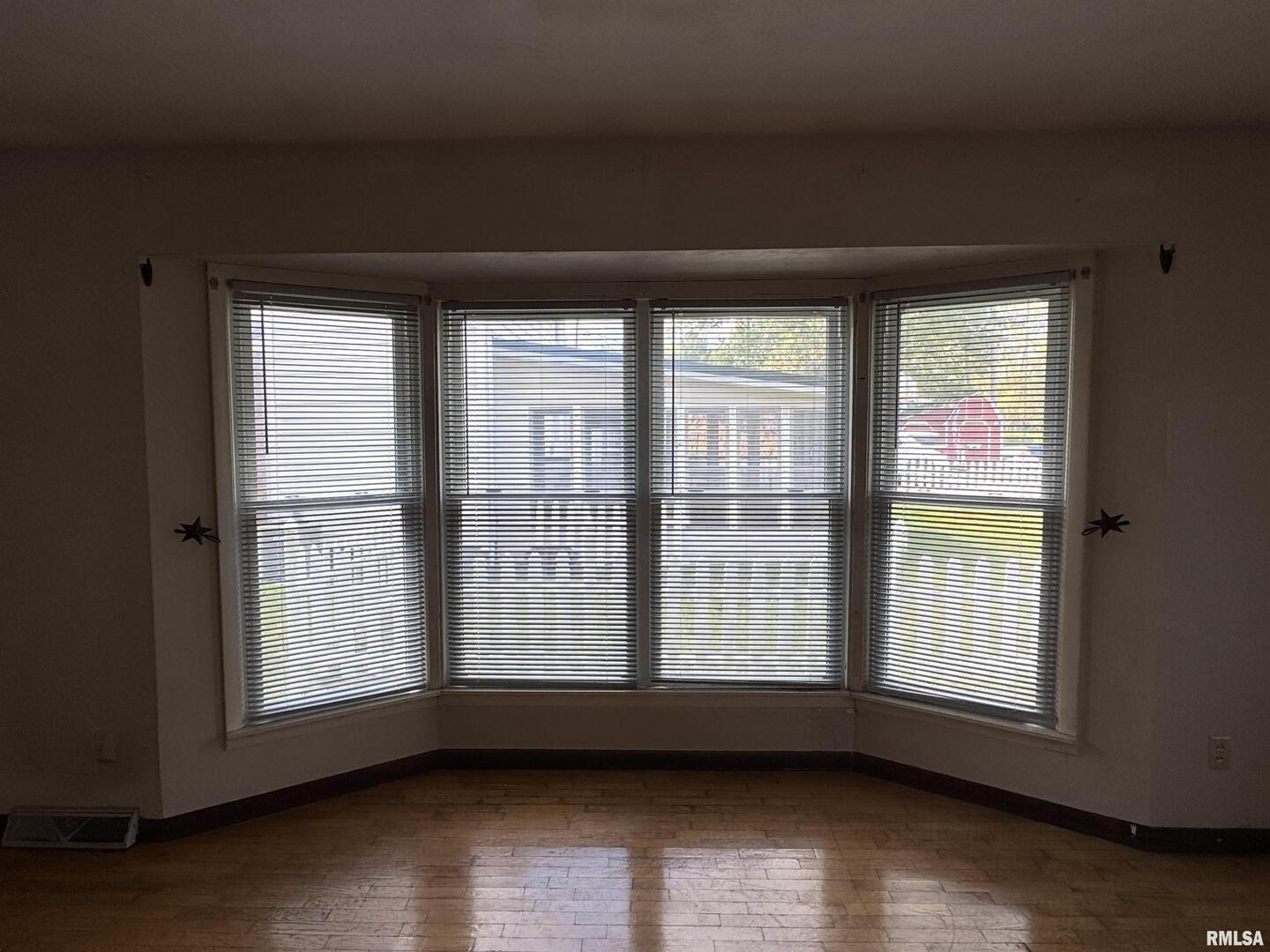 7 Holly Lane Flora, IL 62839 - Photo 9 of 42 a view of empty room with wooden floor and fan