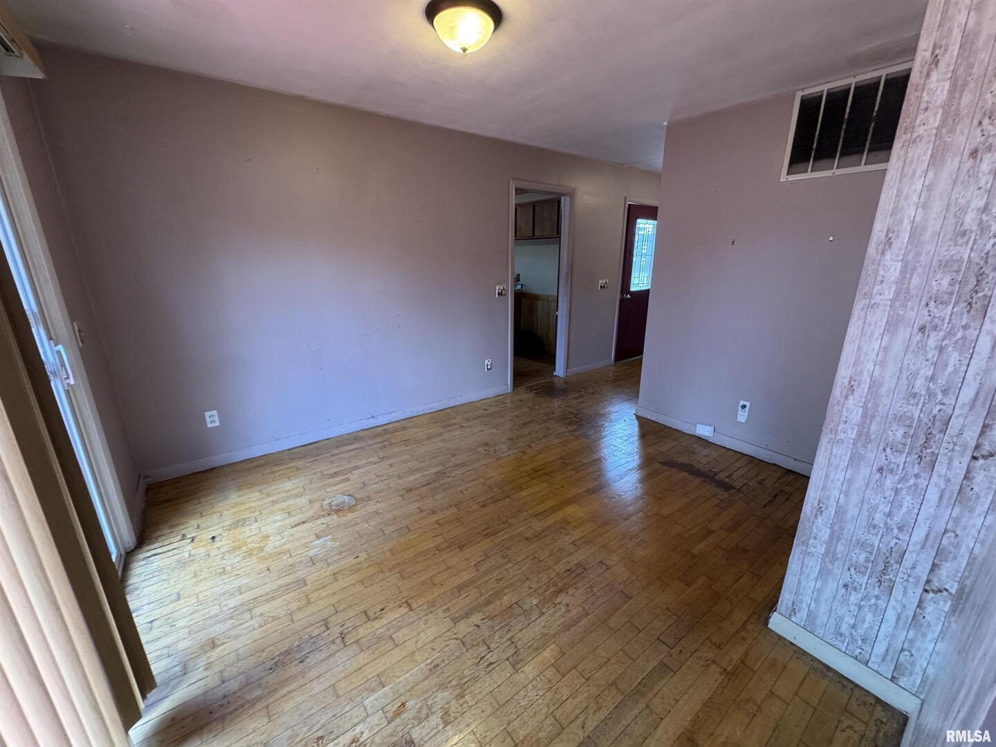 7 Holly Lane Flora, IL 62839 - Photo 10 of 42 wooden floor in an empty room with a window
