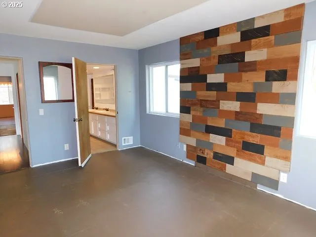 a view of empty room with windows