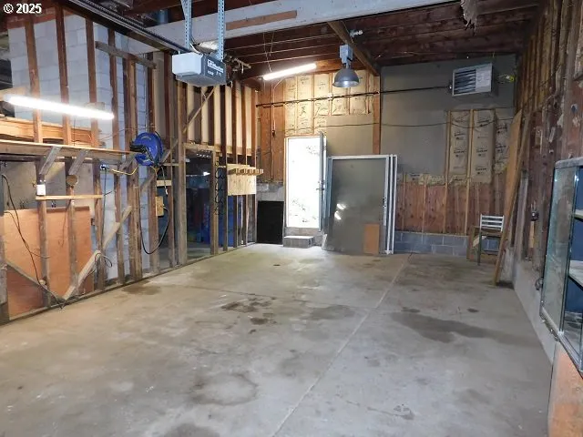 a backyard of a house with large trees and covered with tall trees