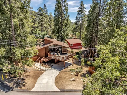 an aerial view of a house with a yard
