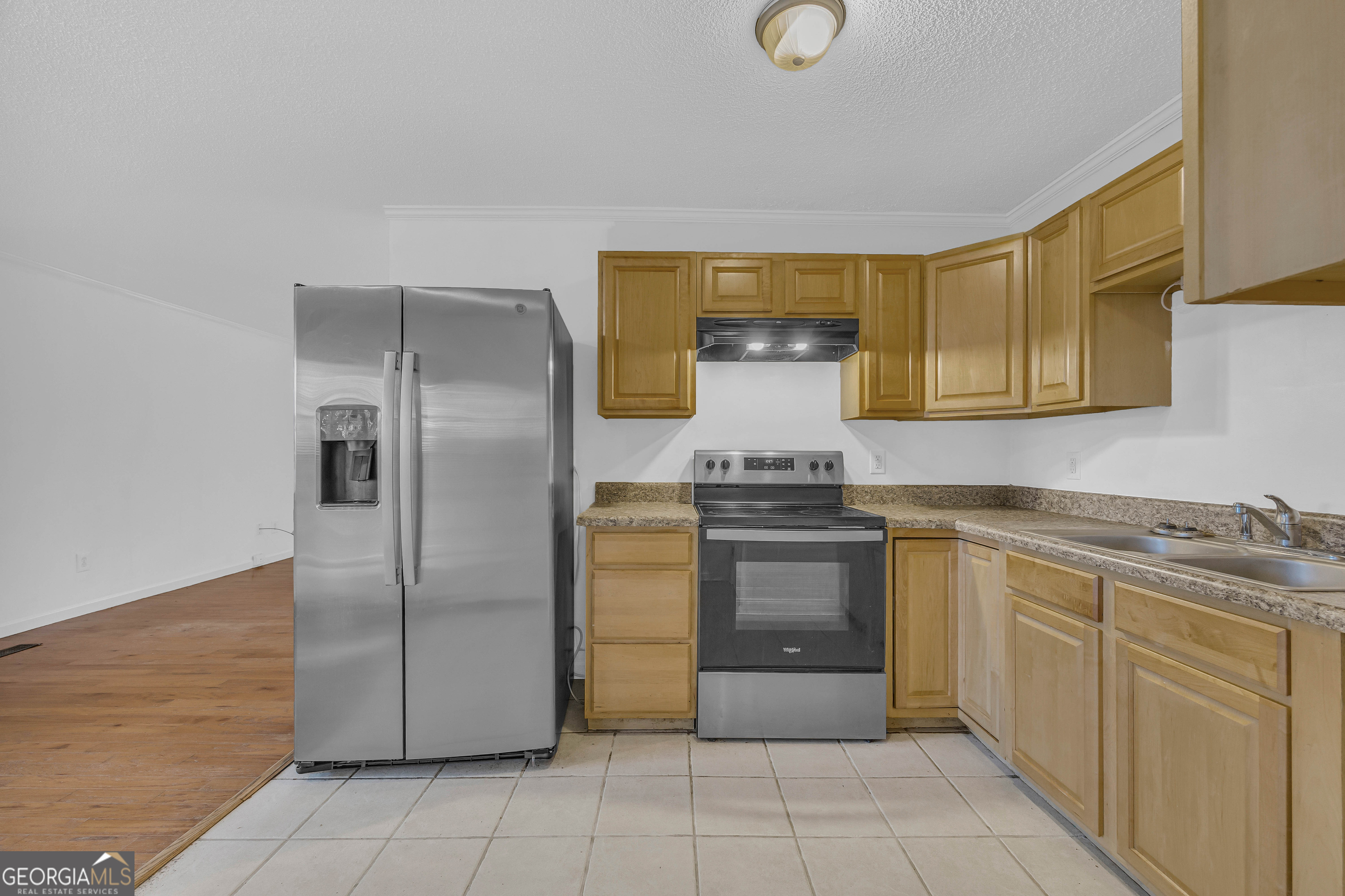260 Pettit Lane Athens, GA 30605 - Photo 14 of 65 a kitchen with stainless steel appliances granite countertop a refrigerator and a stove