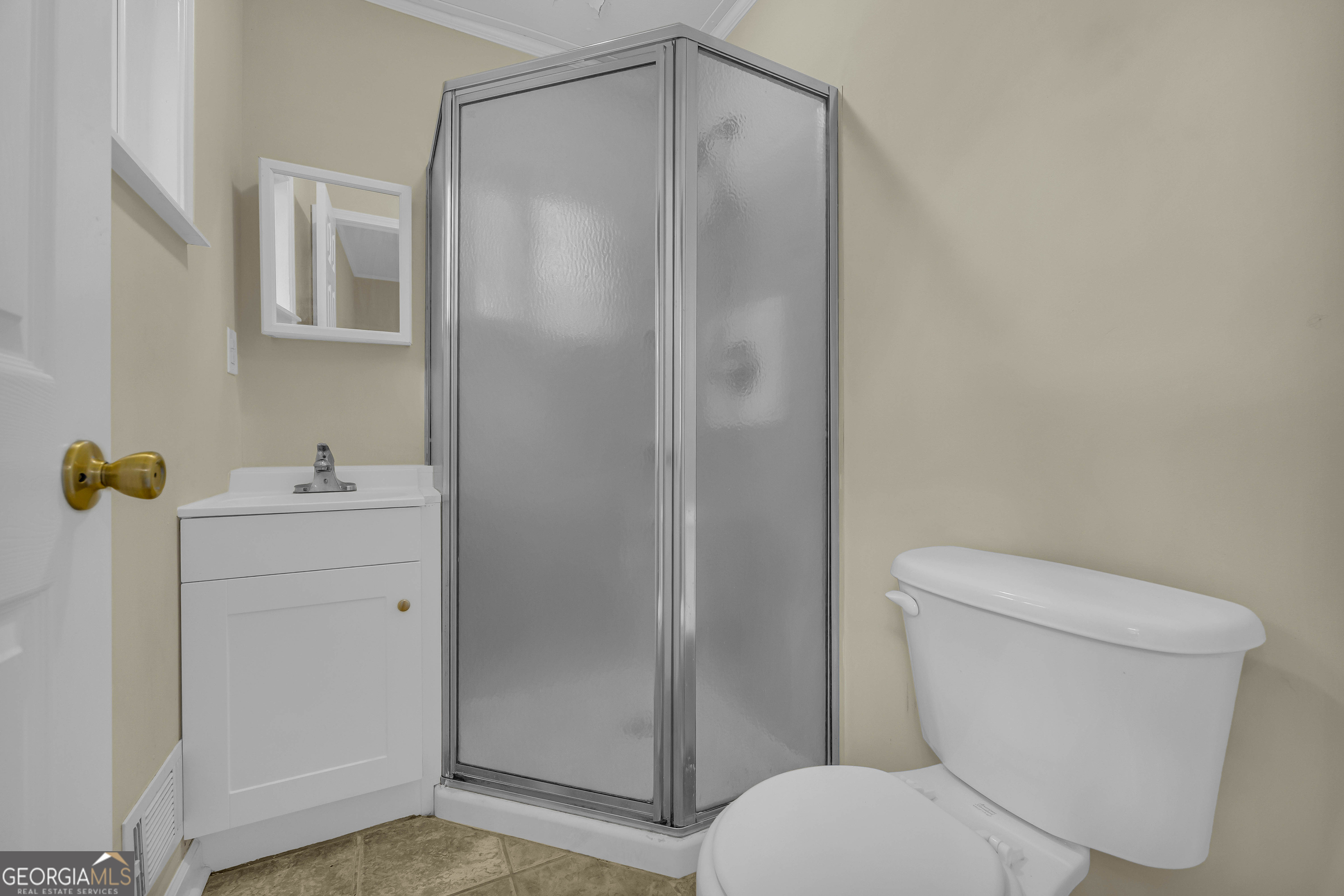 260 Pettit Lane Athens, GA 30605 - Photo 21 of 65 a white toilet sitting next to a bathroom sink