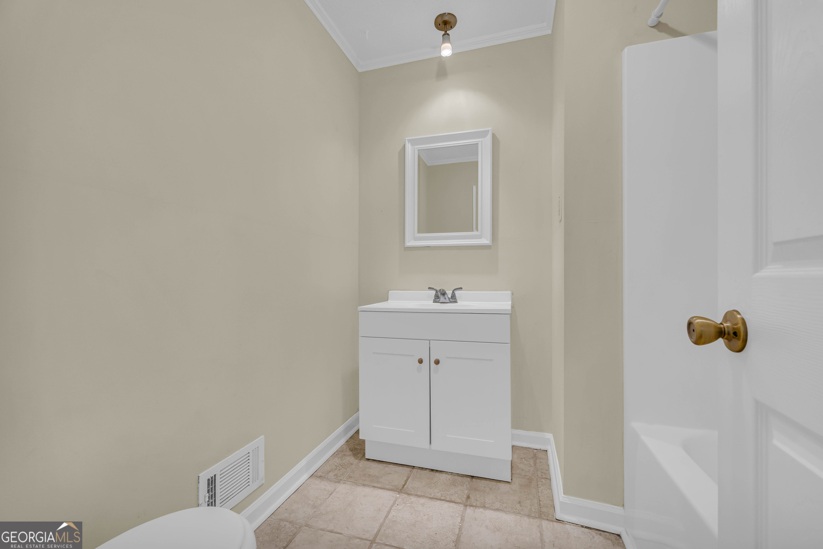 260 Pettit Lane Athens, GA 30605 - Photo 24 of 65 a bathroom with a sink a toilet and mirror