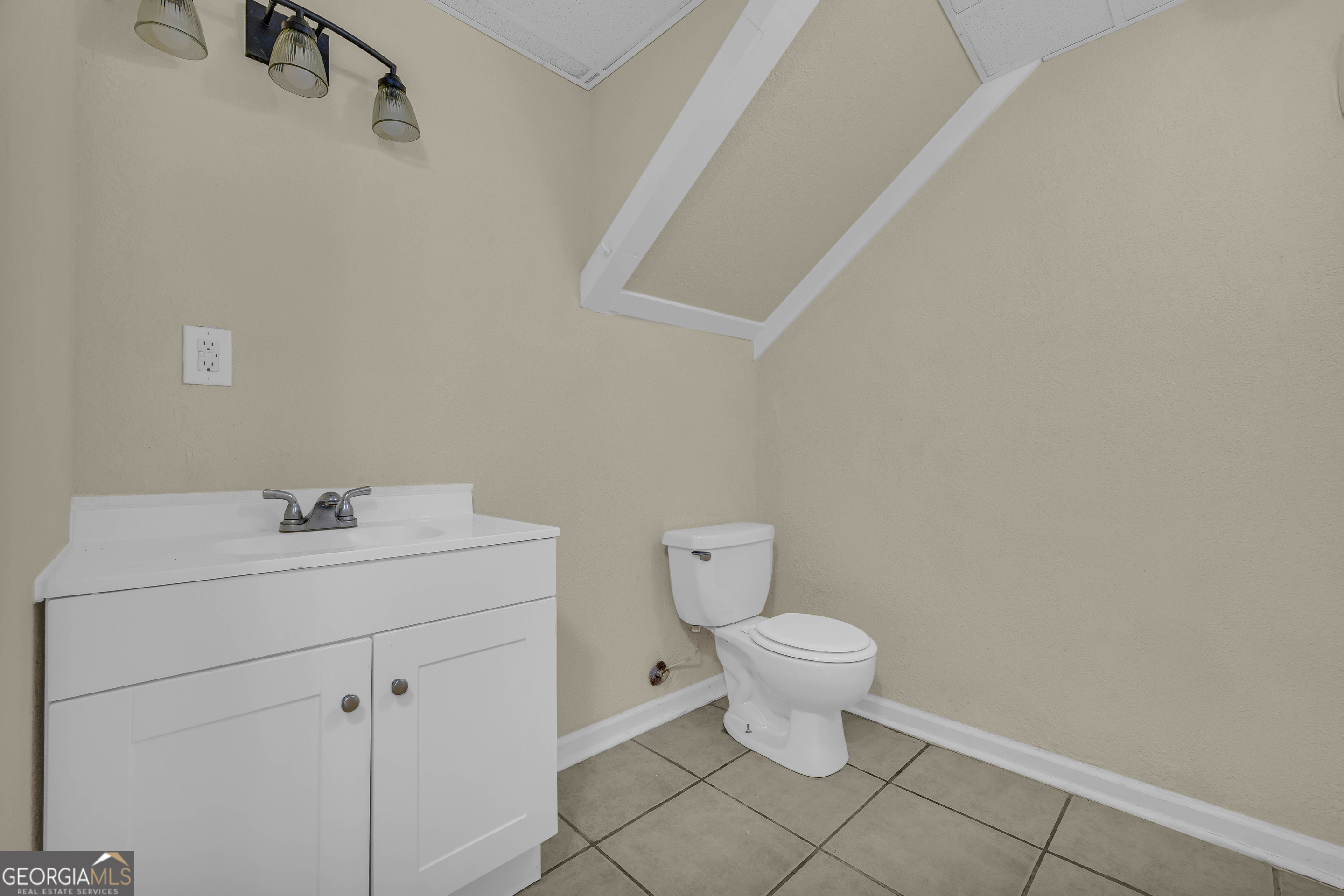 260 Pettit Lane Athens, GA 30605 - Photo 33 of 65 a bathroom with a sink a toilet and a mirror