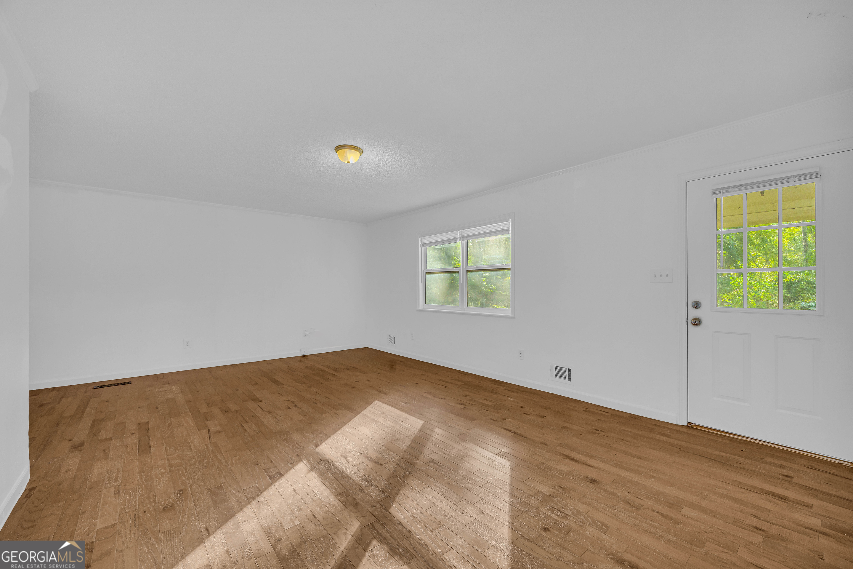 260 Pettit Lane Athens, GA 30605 - Photo 7 of 65 a view of an empty room with a window