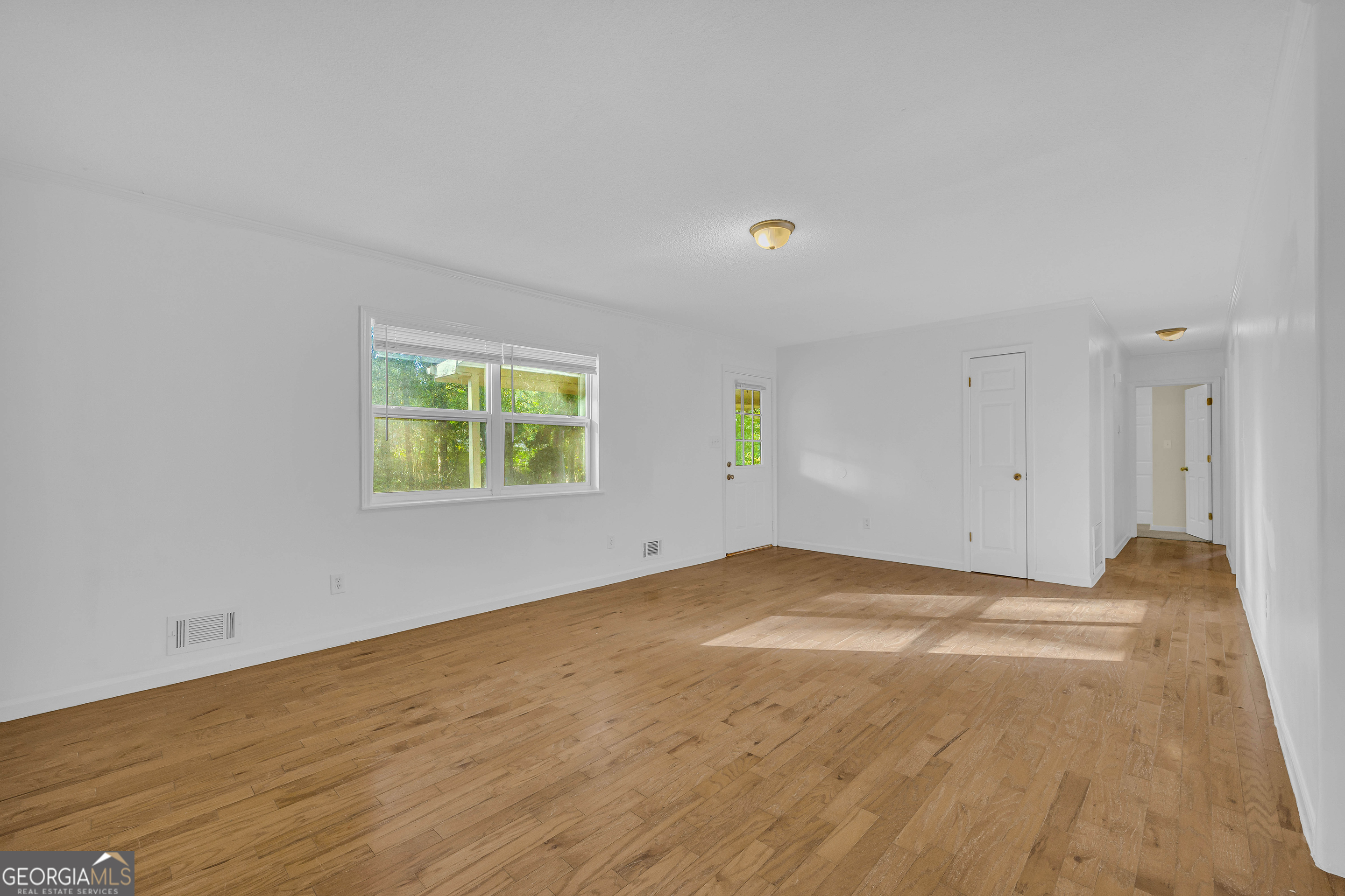 260 Pettit Lane Athens, GA 30605 - Photo 8 of 65 a view of an empty room with a window