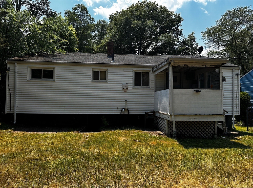 22 Corman Road Boston, MA 02126 - Photo 2 of 29 a front view of a house with a yard