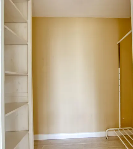 a view of a small space with wooden floor