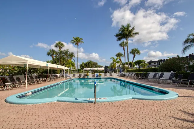 a view of a swimming pool with a patio