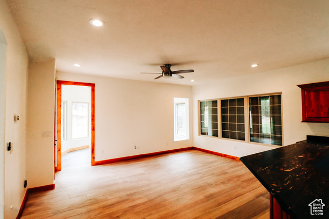 985 Russell Road Hatch, UT 84735 - Photo 9 of 30 Unfurnished living room featuring light wood-type flooring, recessed lighting, and a ceiling fan