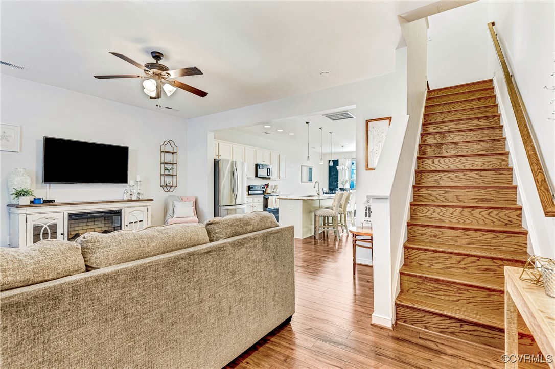 8061 Rutland Village Drive Mechanicsville, VA 23116 - Photo 12 of 22 Living room featuring sink, wood-type flooring, an