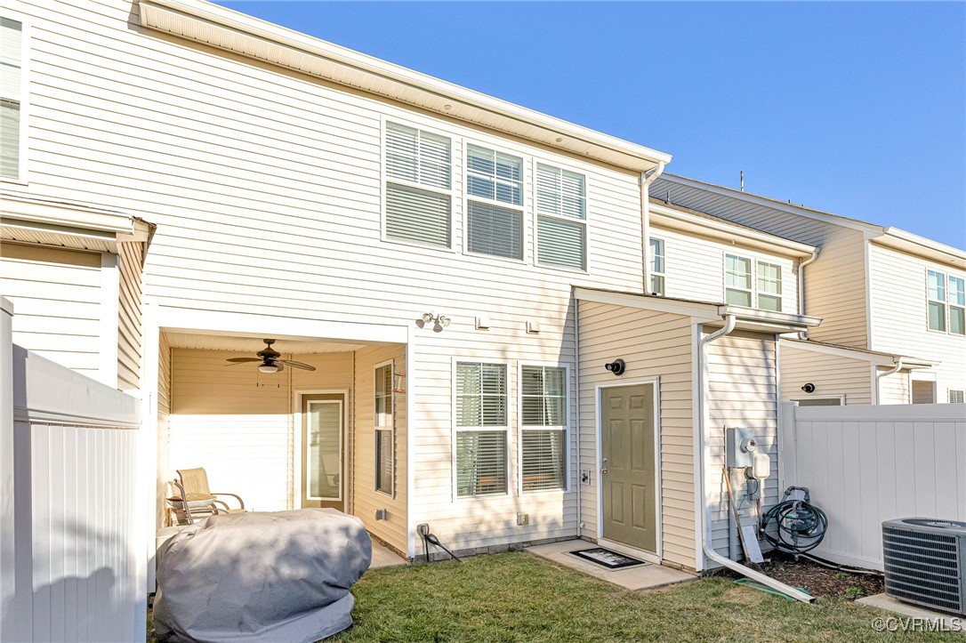8061 Rutland Village Drive Mechanicsville, VA 23116 - Photo 21 of 22 Rear view of property with a yard, central AC, and