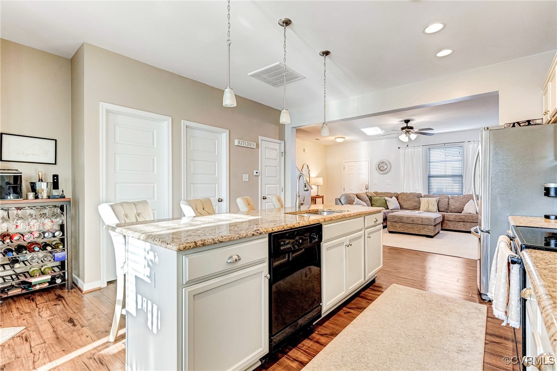 8061 Rutland Village Drive Mechanicsville, VA 23116 - Photo 10 of 22 Kitchen featuring a breakfast bar, pendant lightin