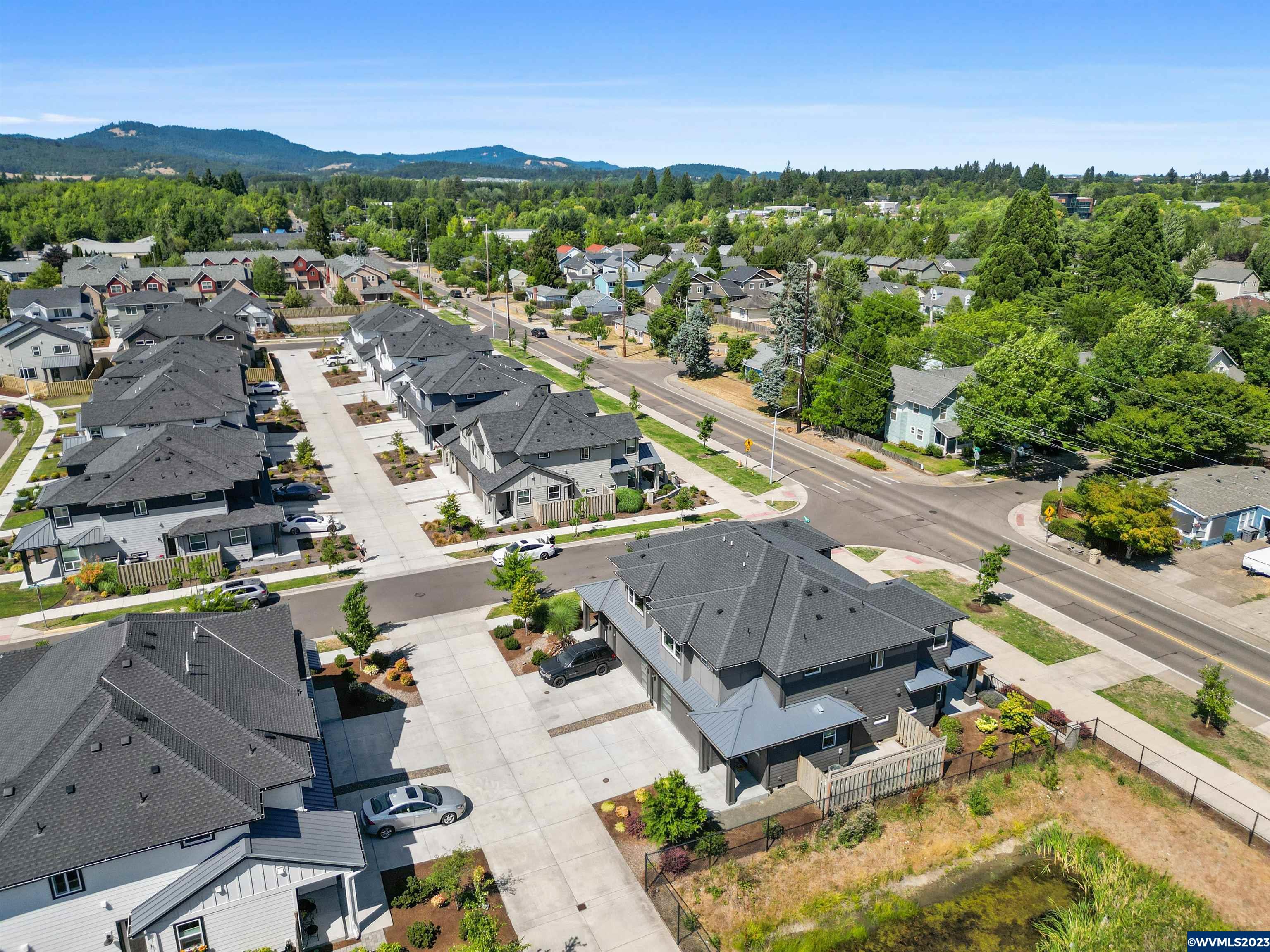 1956 Southwest 53rd Street Corvallis, OR 97333 - Photo 41 of 41 an aerial view of residential houses with outdoor space and river