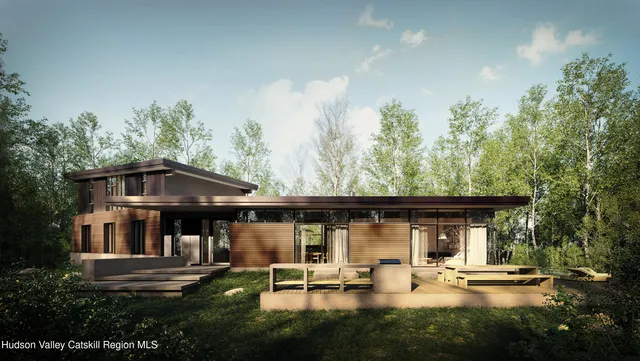 a view of a chair and table in the patio next to a yard