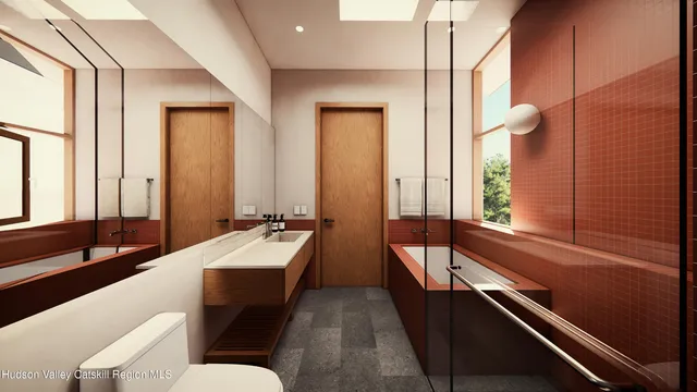 a bathroom with a double vanity sink and mirror with bathtub