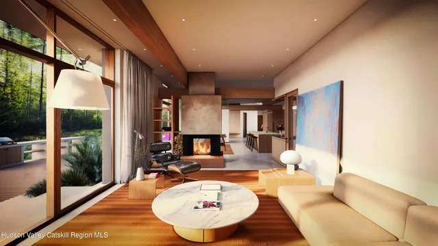 a living room with furniture a large window and wooden floor