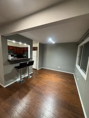 a view of a livingroom with furniture and flat screen tv