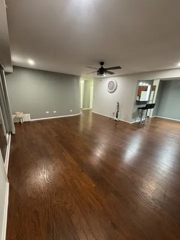 an empty room with wooden floor