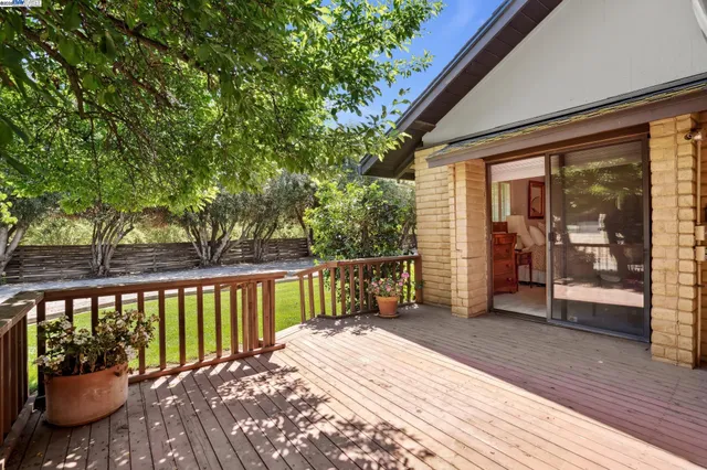 an empty room with a sink and mirror